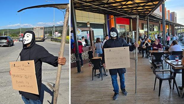 Düzce'de ilginç görüntü! Maske takıp ‘Bana iş çıkarmayın’ pankartı ile sürücüleri uyardı